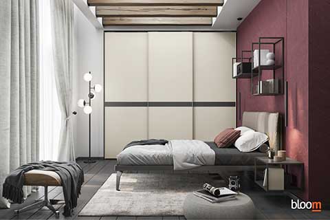 Armadio scorrevole con letto matrimoniale e comò con specchio